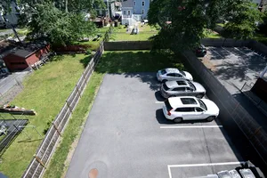 Private backyard parking area offering secure convenience.