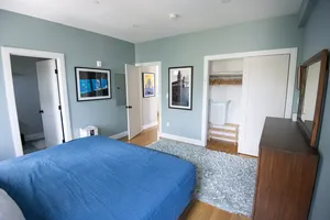 Comfortable bedroom suite with elegant decor and soft tones.