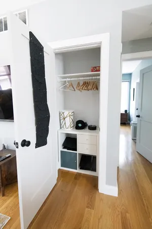 Convenient coat closet with tidy storage solutions.