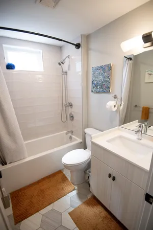 Sophisticated guest bathroom with modern fixtures and clean lines.