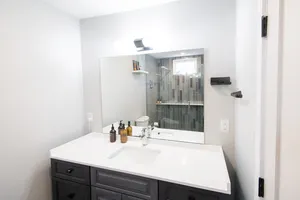 Elegant ensuite with sleek fixtures and stylish decor.